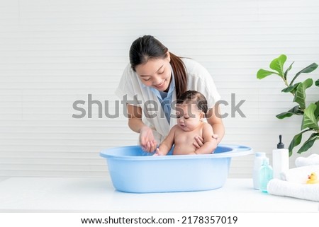 Similar – Foto Bild Mutter badet Baby zu Hause