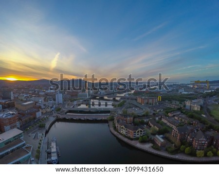 aerial view on river and bridge in belfast northern ireland. beautiful sunset over city view from above 