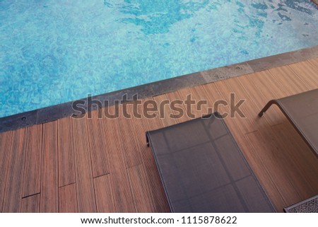 Top View Of Swimming Pool With Relax Black Modern Rattan Chairs On Wooden Floor 1115878622 Top View Of Swimming Pool With Relax Black Modern Rattan Chairs On Wooden Floor 1115878622