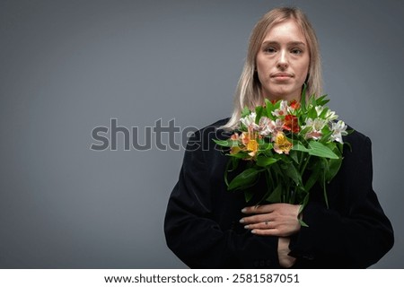 Similar – Image, Stock Photo Serious woman with blooming twigs in garden