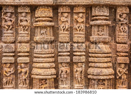 Ancient sandstone carvings on the walls of the ancient Indian temple of Konark.