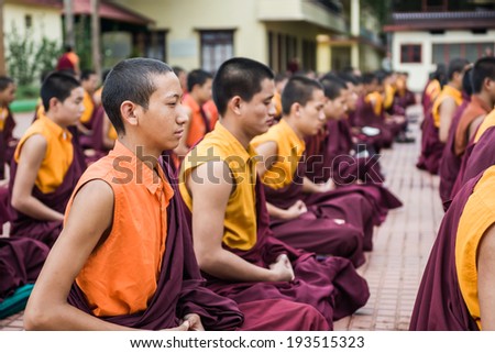 Kushalnagar, India - JUNE 25th 2009 - Buddhist Monks sitting in meditation in a monastery in Kushalnagar, India June 25th 2009.
