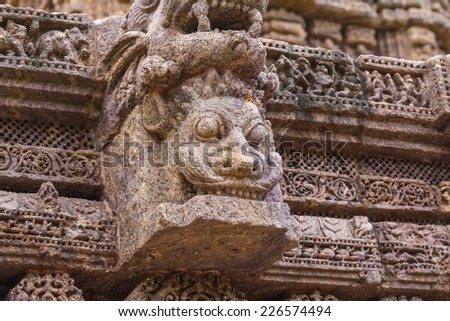 A gargoyle caved from sandstone at the ancient sun temple at Konark, India.