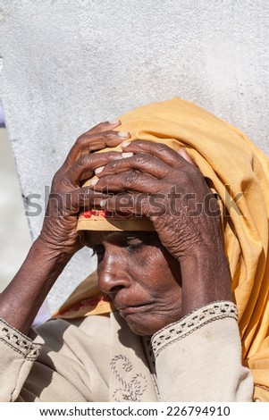 BADARINATH - INDIA, JUNE 5th - An old female pilgrim at the temple of Badarinath in North India on June 5th 2013
