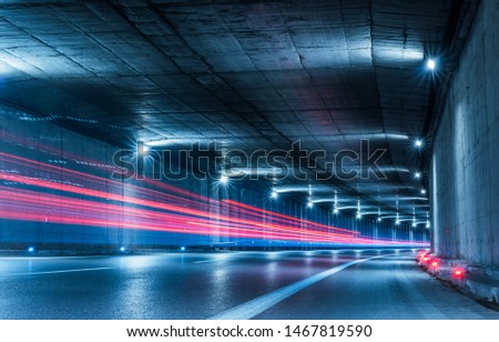 Similar – Image, Stock Photo Highway tunnel. Interior of urban tunnel without traffic in nught with blue lights. Rome, Italy