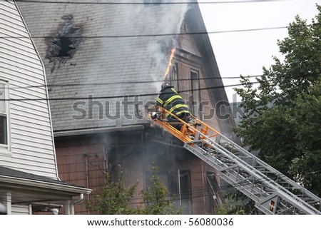 SOMERVILLE, MASSACHUSETTS - JUNE 27: Firefighters from at least 4 fire house battle a blaze at 111 Glenwood Road June 17,2010 in Somerville, MA
