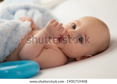 baby sucking his thumb on white background Stockfoto © 