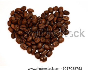 Photo of Heart consisting of coffee beans isolated on white background. Love of coffee. Image with free space for text.