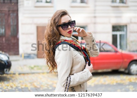 https://image.shutterstock.com/display_pic_with_logo/171085180/1217639437/stock-photo-young-beautiful-stylish-woman-walking-down-the-street-on-a-cold-winter-snowy-day-fashionable-girl-1217639437.jpg