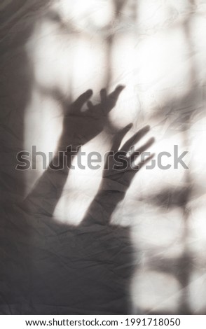 Similar – Image, Stock Photo Two shadows hands in red and green light circle.