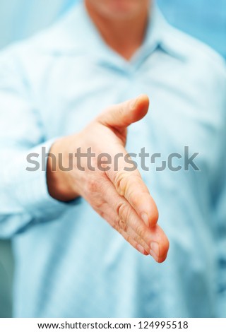 Image of businessman extending hand to shake