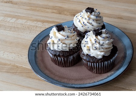 Similar – Image, Stock Photo small vanilla and chocolate muffins illuminated by the morning light ready for breakfast
