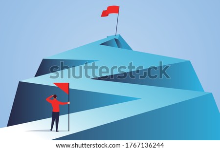 Businessman holding a flag looking at the flag farther from the top of the arrow