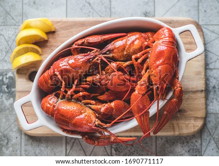 Red boiled crayfish with lemon on a cutting board. ストックフォト © 