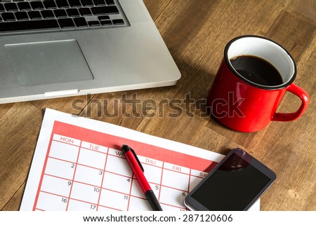 Working with the laptop and organizing monthly activities and appointments in the calendar
