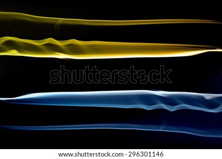 abstract blue and gold smoke on black background, smoke background ,blue smoke and gold background, blue,gold ink