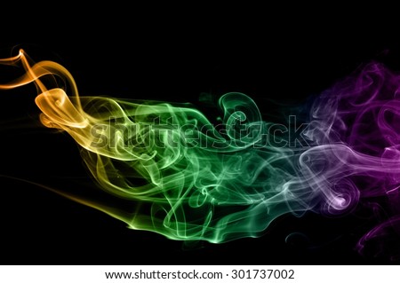 Abstract colorful smoke on black background, color background,colorful ink background,Violet, Green, Orange