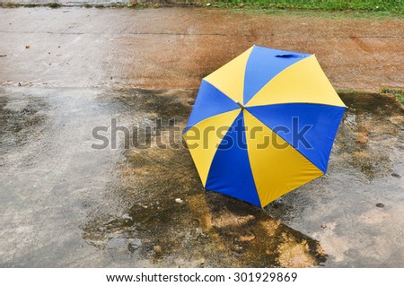 umbrella on the floor wet after rain