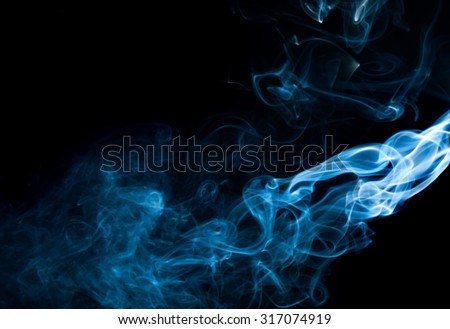 movement of  smoke Abstract white and blue smoke on black background, white and blue smoke background,Light blue ink background,blue fire