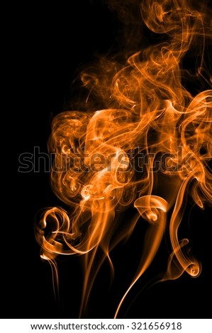 Abstract orange smoke on black background, orange smoke background,orange ink background,orange smoke, beautiful color smoke,movement of orange smoke