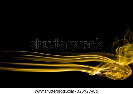 movement of gold smoke, Abstract gold smoke on black background, gold background,gold ink background,yellow smoke