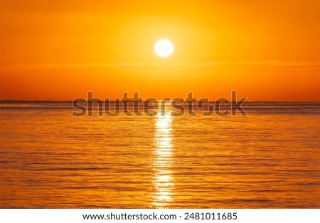 Image, Stock Photo Scenic sunset over sea and snowy mountains