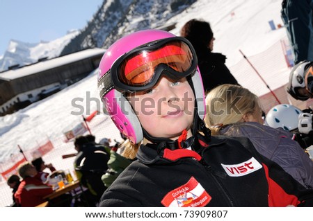KAPRUN AUSTRIA - MARCH 5: Maiskogel Fanlauf 2011. Unidentified girl after race at charity ski race with many celebrities in austria on March 5, 2011 at the Maiskogel in Kaprun, Austria
