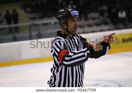 ZELL AM SEE; AUSTRIA - SEPT 24: Austrian National League. The referee warns two players. Game EK Zell am See vs EHC Lustenau (Result 1-8) on September 24, 2011 in Zell am See.