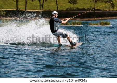 cable wakeboard with a man on it who got pulled by rope over lake at a wake park Stock fotó © 