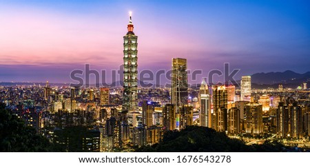 View from above, stunning view of the Taipei City skyline illuminated at dusk during a beautiful sunset. Taipei officially Taipei City, is the capital and a special municipality of Taiwan. 商業照片 © 