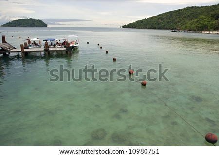 Wooden dock with floating guide line near the beach at Manukan Island, Sabah, Malaysia