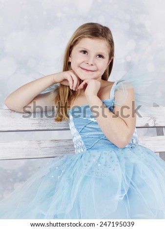 Adorable smiling girl with angel face