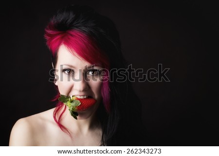 Beautiful sexy woman eating strawberry
