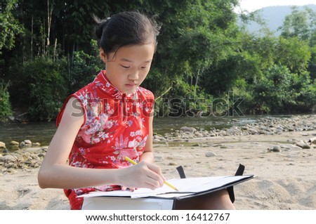 A Chinese girl in Chi-pao   draws from nature on an easel by a creek.