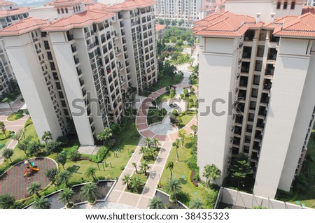 The modern high rise buildings with gardens and playground in a residential aparment block.