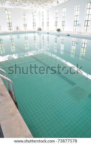 Indoor swimming pool with clean and clear water.