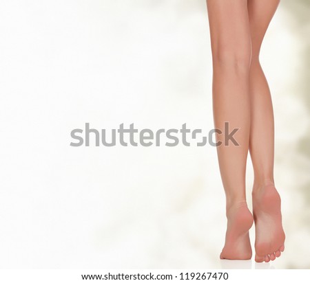Legs of a woman against abstract background with circles and copyspace