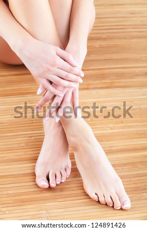 Well-groomed female hands and feet