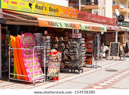 Benalmadena, Spain - April 24, 2013:The kiosks full of postcards and souvenirs on a town longest beach on April 24, 2013 in Benalmadena. Benalmadena is one of the most beautiful sea resorts of Spain.