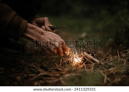 Similar – Foto Bild Mann mit Brennholz beim Lagerfeuermachen im Wald