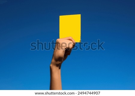 Similar – Image, Stock Photo Hand holds a yellow arrow with the word luck on it against a neutral turquoise background. Way to happiness.