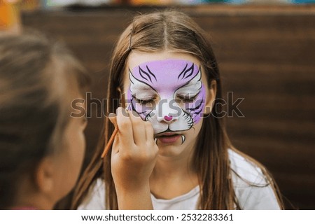 Similar – Image, Stock Photo Makeup artist painting face of calm woman