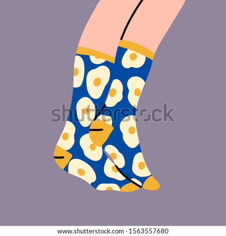 Foot, feet. Pair of female or male legs in the socks. Cool design. Sunny side up egg print. Stylish underwear. Fashion accessories. Footwear. Hand drawn vector colored trendy illustration. Flat design