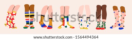 Set of seven pairs of female or male legs in the socks. Cool various prints. Stylish underwear. Fashion accessories. Footwear. Hand drawn vector colored trendy illustration. Flat design