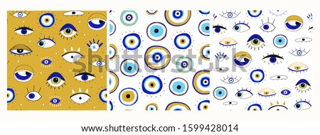 Set of three seamless patterns. Evil eyes. Hand drawn various talismans. Different shapes. Flat design. Free hand drawing style. Contemporary modern trendy vector illustrations.