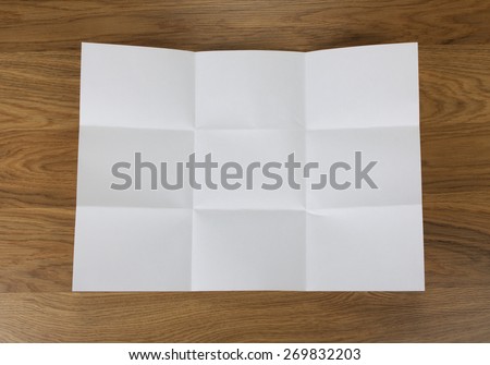 White sheet of paper folded in nine top shooting