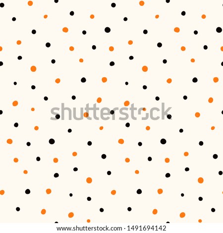 Halloween hand drawn seamless vector pattern with orange and black polka dots on a white background. Flat style design. Concept for children textile print, wallpaper, wrapping paper, holiday decor.