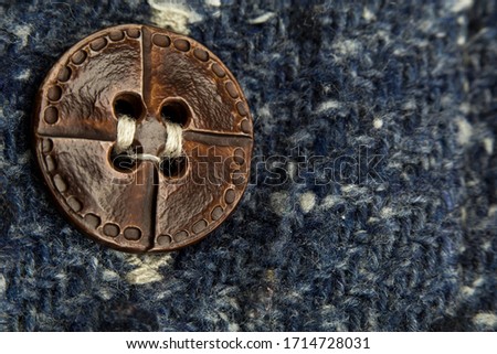 macro or close-up photo of the vintage shirt button. the focus on the button. this is textile, texture, or tissue concepts. It could be also background, wallpaper, abstract concept. Stock fotó © 