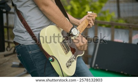 Similar – Image, Stock Photo Guitarist playing outdoors