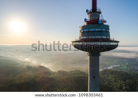 Similar – Image, Stock Photo The TV tower and people in the park in the sunshine on the road